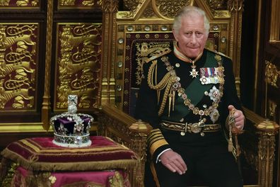 FILE - Prince Charles is seated next to the Queen's crown during the State Opening of Parliament, at the Palace of Westminster in London, May 10, 2022. Queen Elizabeth II did not attend the opening of Parliament amid ongoing mobility issues. Prince Charles has been preparing for the crown his entire life. Now, that moment has finally arrived. Charles, the oldest person to ever assume the British throne, became king on Thursday Sept. 8, 2022, following the death of his mother, Queen Elizabeth II.