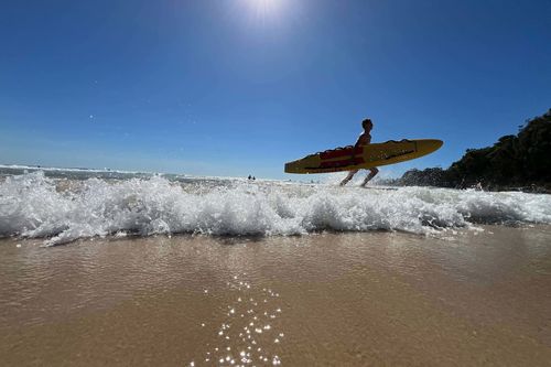 Surf lifesavers watch the surf at Narrawallee Beach as the temperature hits 35 degrees at 9.30am, 10 January 2026.
