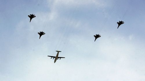 Chinese military jets fly over Beijing during a rehearsal.