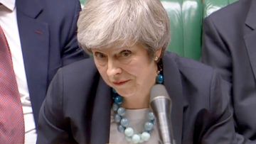 UK Prime Minister Theresa May addresses the House of Commons as she announces a postponement to a crucial vote on her Brexit deal.