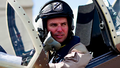 Why is a former fighter pilot wanted by the US government?