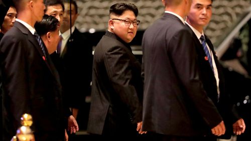 North Korean leader Kim Jong-un walks out from the Marina Bay Sands during a city tour in Singapore. (AAP)