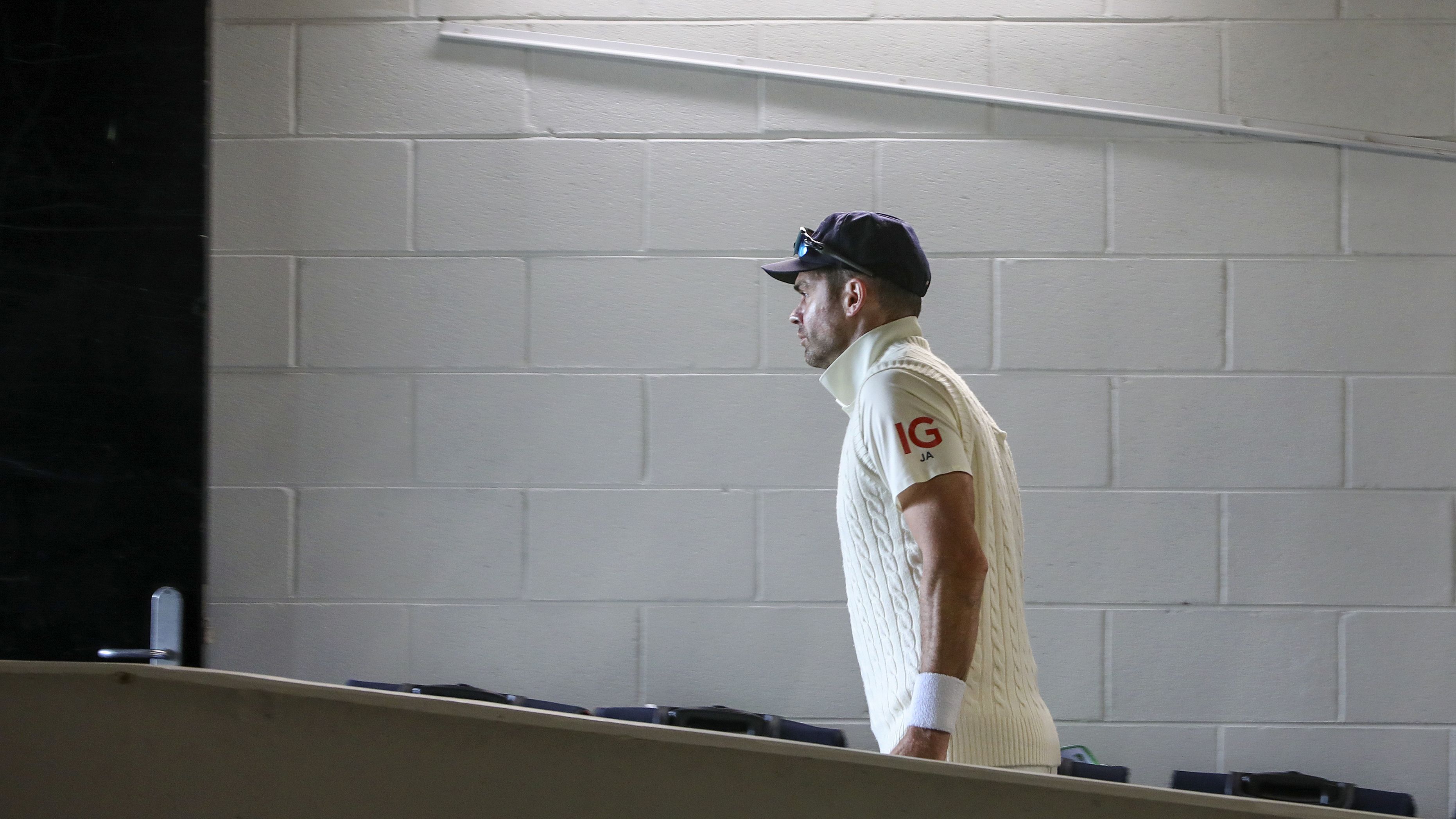 England&#x27;s James Anderson walks up a ramp to the field at the start of play.