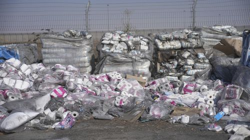 FILE - Piles of humanitarian aid packages wait to be picked up on the Palestinian side of the Kerem Shalom crossing in the Gaza Strip, Thursday, July 24, 2025, during a media tour organized by the Israeli army. (AP Photo/Ohad Zwigenberg, file)