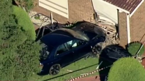 Naked man allegedly crashes car through Melbourne home