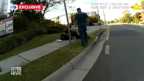 Bodycam footage shows the officers on the Gold Coast outnumbered and under attack by a group of men in the middle of a Gold Coast highway.