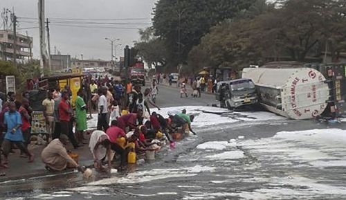Nigerians collecting fuel from a crashed Petroleum tanker moments before it exploded on the Ikom-Calabar Highway, Calabar, Nigeria.