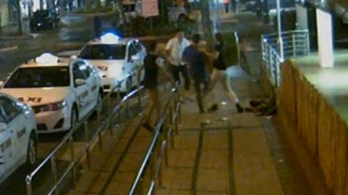 The CCTV tendered to court shows the brazen attack outside the taxi rank. (9NEWS)