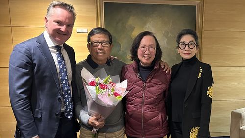 Chau Van Kham with his wife, Quynh Trang Truong, both centre, and Kham's lawyer (right) and MP Chis Bowen (left).