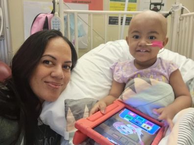 Maryanna with Fiapule in hospital during cancer treatment.