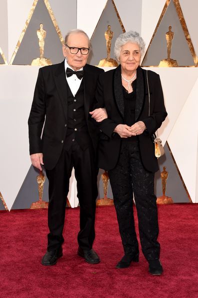 talian composer Ennio Morricone and his wife Maria Travia attend the 88th Annual Academy Awards at Hollywood & Highland Center on February 28, 2016 in Hollywood, California.