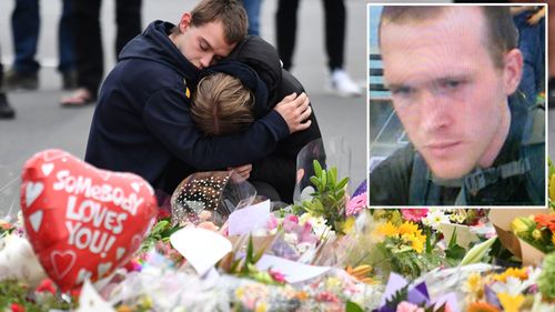 Members of the public mourn at a flower memorial and Brenton Tarrant