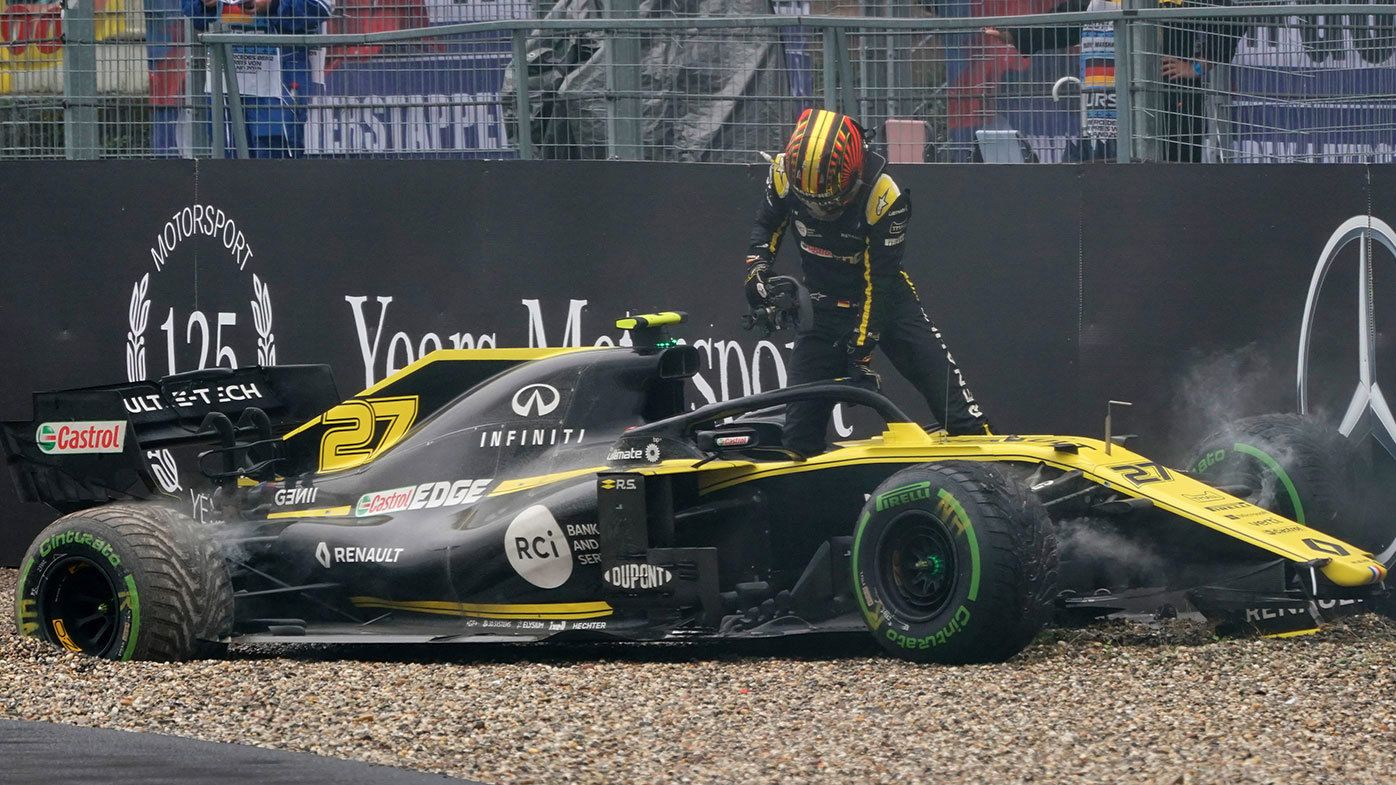 Nico Hulkenberg climbs out of his crashed Renault at the German Grand Prix.