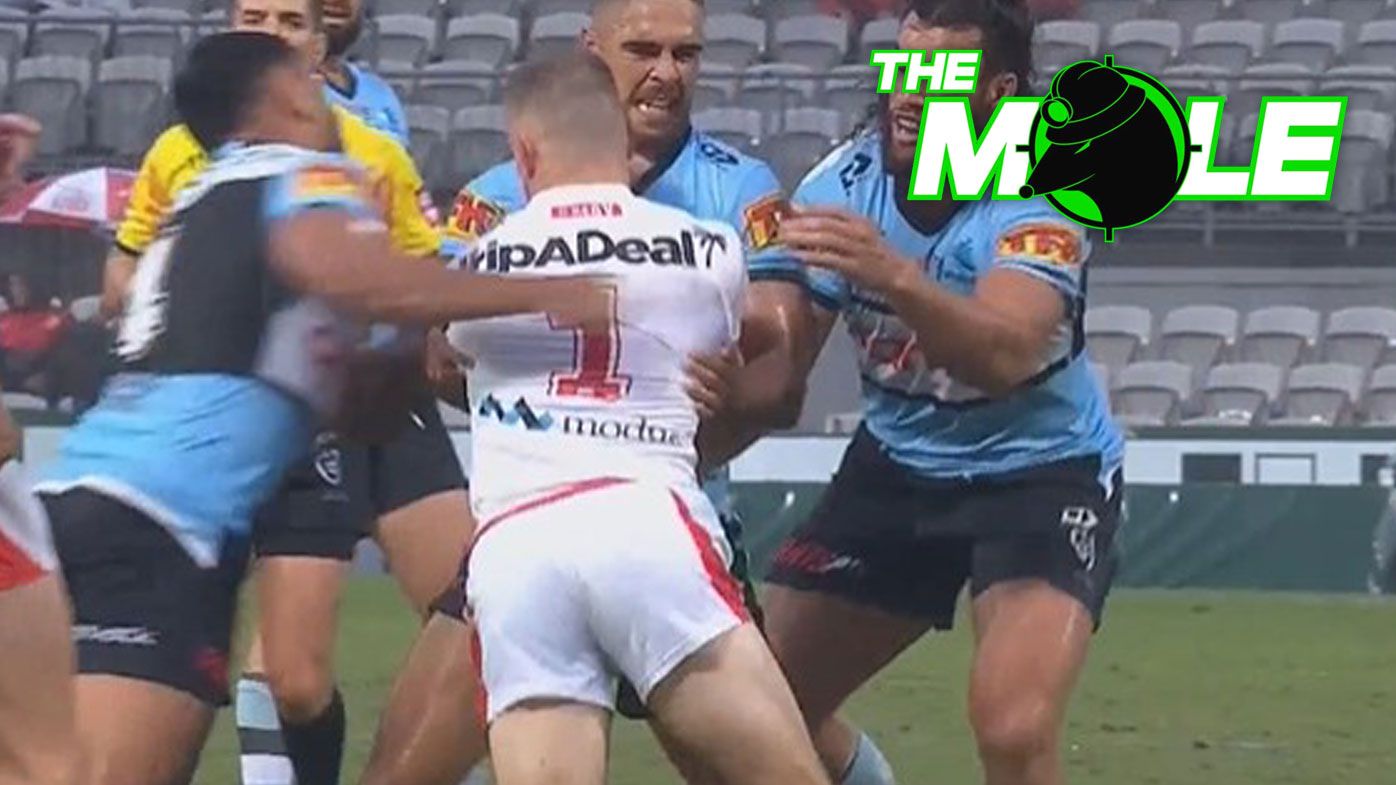 Jesse Ramien hits Matt Dufty with a swinging arm in the round one clash between the Dragons and Sharks.