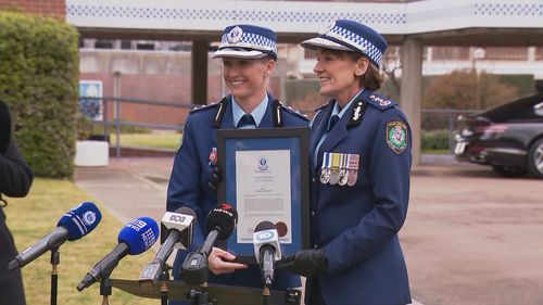 Inspector Amy Scott receives the Commissioners Valour Award during a ceremony at the NSW Police Academy in Goulburn