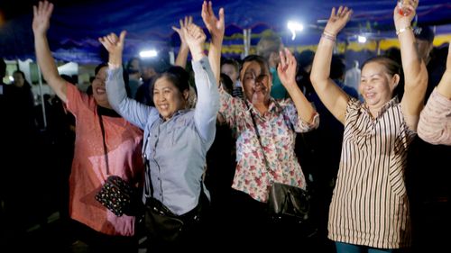 Parents cheer as the team is freed. 