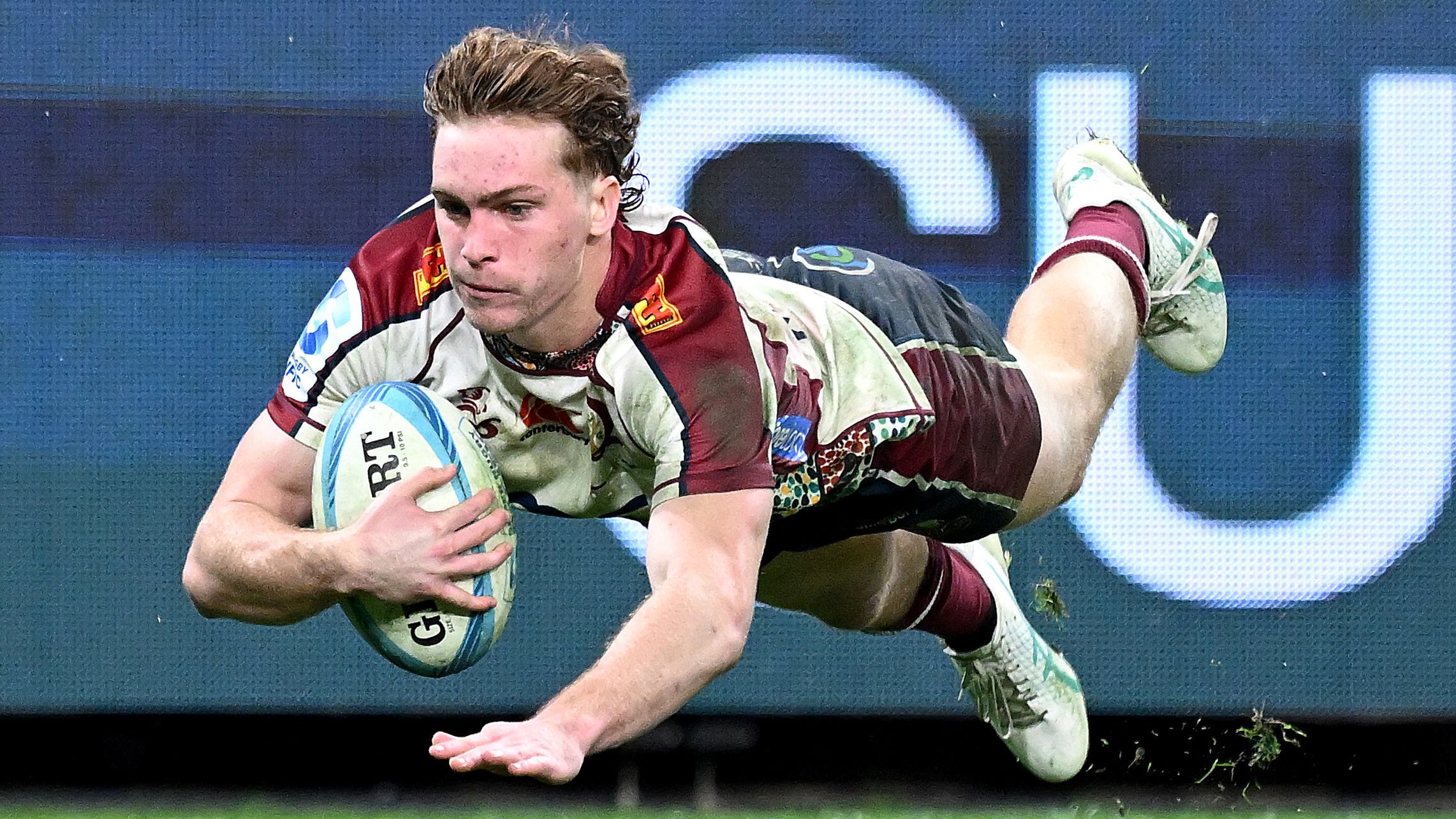 Tim Ryan of the Reds dives over to score a try during the round 14 Super Rugby Pacific match between Queensland Reds and Western Force.