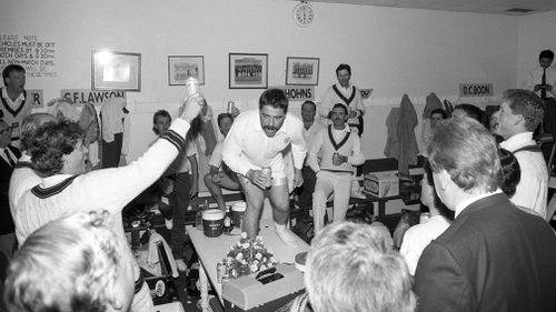 Australian player David Boon leads the team in a rendition of the team song 'Under the Southern Cross' in 1989. (Philip Brown, Popperfoto, Getty Images)