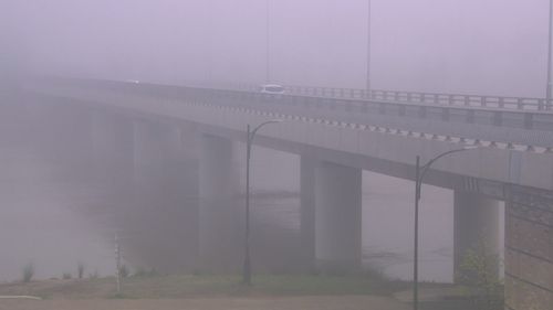 The Windsor Bridge was shrouded in fog this morning amid the risk of minor flooding in Penrith over the weekend.