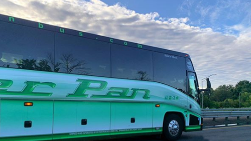 A woman made a frantic call to police from the luggage compartment of a moving bus after being locked in there by the woman driver.