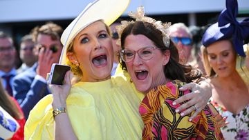 Elyse Zahra, wife of jockey Mark Zahra, and Claire, sister of Mark, are seen after Without A Fight won the Melbourne Cup at Flemington Racecourse.
