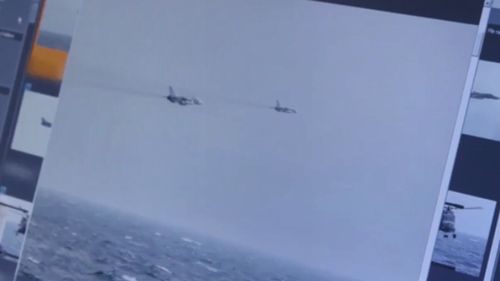A command post computer screen shows two of the Russian fighter jets flying past HMS Duncan.