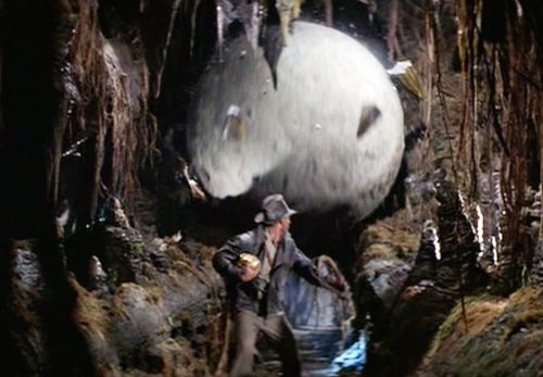 Harrison Ford in Indiana Jones: Raiders of the Lost Ark being chased by a giant boulder. 