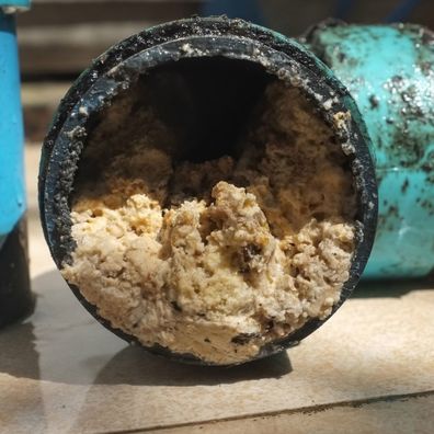 Sydney Water shared this image of a pipe blocked with solidified cooking oil