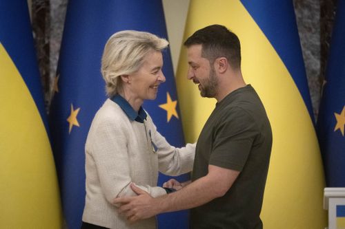 Ukrainian President Volodymyr Zelenskyy, right, and European Commission President Ursula von der Leyen