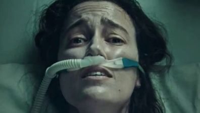 A woman fights for breath in a new coronavirus television ad, which government officials hope will rally Australians into getting vaccinated.