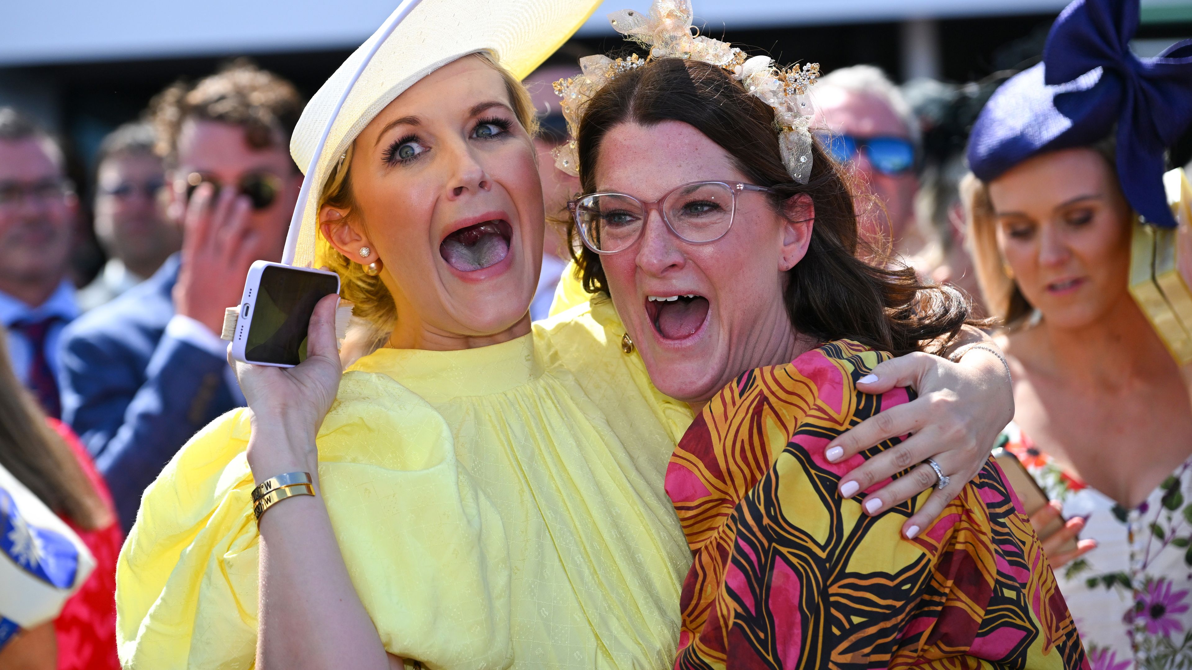 Elyse Zahra, wife of jockey Mark Zahra, and Claire, sister of Mark, are seen after Without A Fight won the Melbourne Cup at Flemington Racecourse.