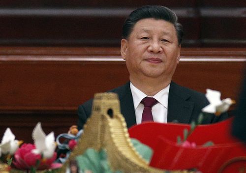 Chinese President Xi Jinping arrives at a dinner marking the 70th anniversary of the founding of the People's Republic of China at the Great Hall of the People in Beijing. Xi renewed his government's commitment to allowing Hong Kong to manage its own affairs amid continuing anti-government protests in the semi-autonomous Chinese territory.