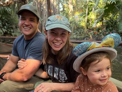 Bindi Irwin with her husband and daughter at Disneyland.