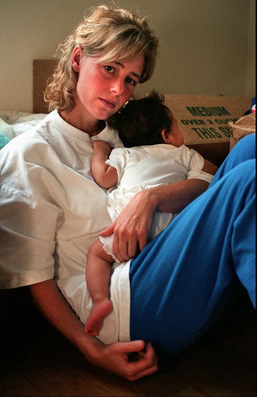 Mary Kay LeTourneau holds the baby in Normandy Park. Picture: AAP