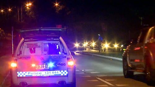 The officer stopped his vehicle on Luxford Road after he saw two men fighting. (9NEWS)