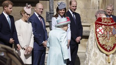Members of Britain's Royal family watch as Britain's Queen Elizabeth II arrives to attend the Easter Mattins Service at St. George's Chapel, at Windsor Castle in England Sunday, April 21, 2019