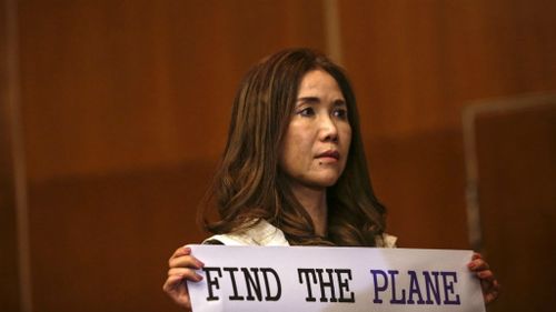 A woman pleads with ministers at the MH370 Ministerial Tripartite Meeting in Malaysia yesterday. (AAP)