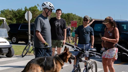 Joe Biden with his dog after a bike ride