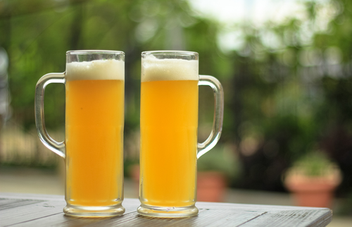 Two beers on outdoor table