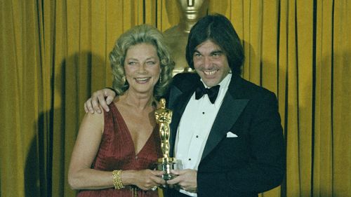 Actress Lauren Bacall is shown presenting Oscar to director Oliver Stone for "Midnight Express" at the 51st Annual Academy Awards in Los Angeles on April 9, 1979. (AAP)