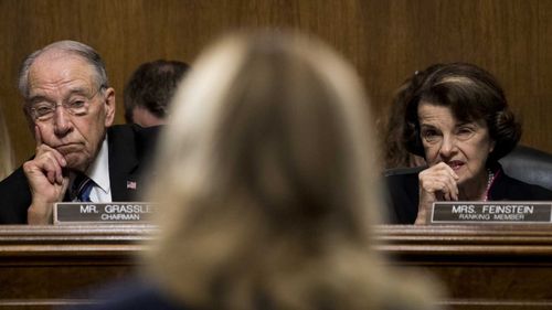 Republican Judiciary Committee chairman Senator Chuck Grassley and Democratic ranking member Senator Dianne Feinstein listen to Dr Christine Blasey Ford's testimony.