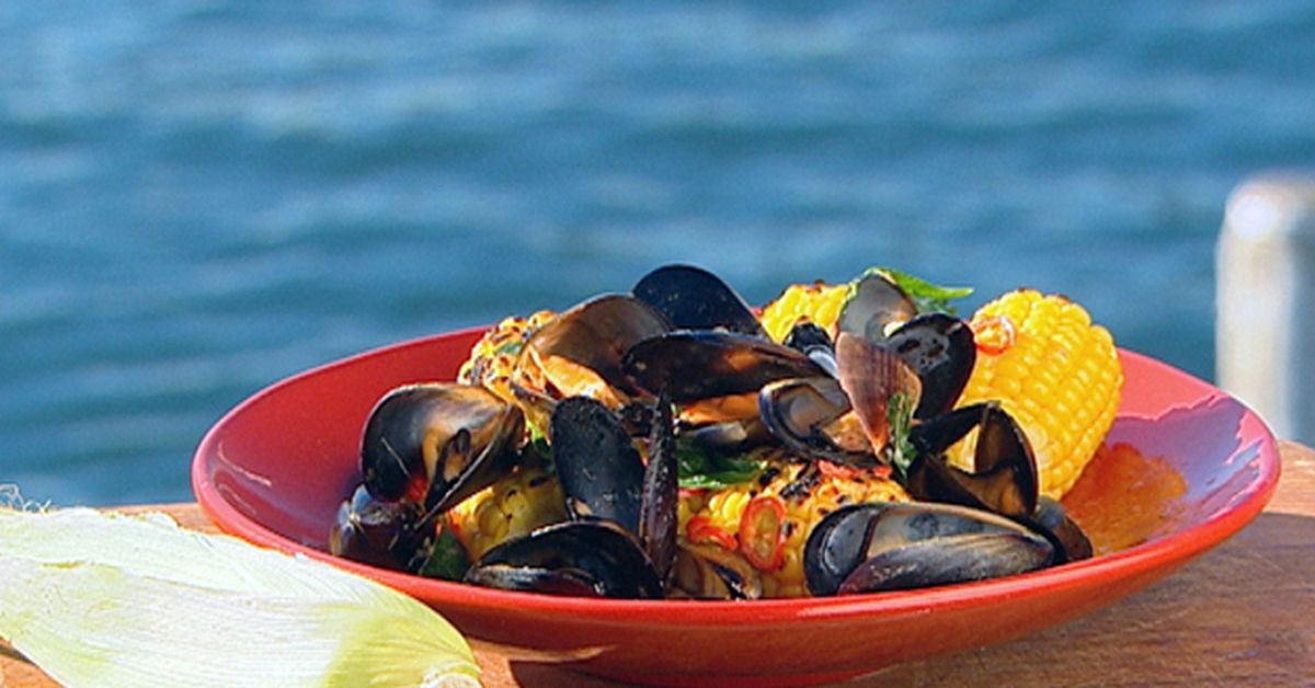 Platter of barbecue mussels and corn with roasted garlic butter - 9Kitchen