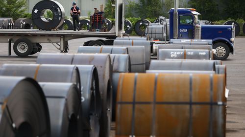 HAMILTON, CANADA - JUNE 09: A worker affixes a steel coil to a truck at ArcelorMittal Dofasco's steel mill on June 9, 2025 in Hamilton, Canada. President Donald Trump announced plans to double tariffs on steel and aluminum imports from 25% to 50%, affecting top steel partners, including Canada, Brazil, and Mexico. (Photo by Cole Burston/Getty Images)