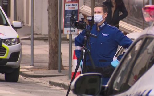 Forensic police photograph the crime scene. Picture: 9NEWS