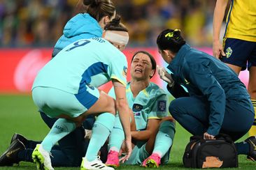 Matildas star Sam Kerr writhes in agony after injuring her leg.