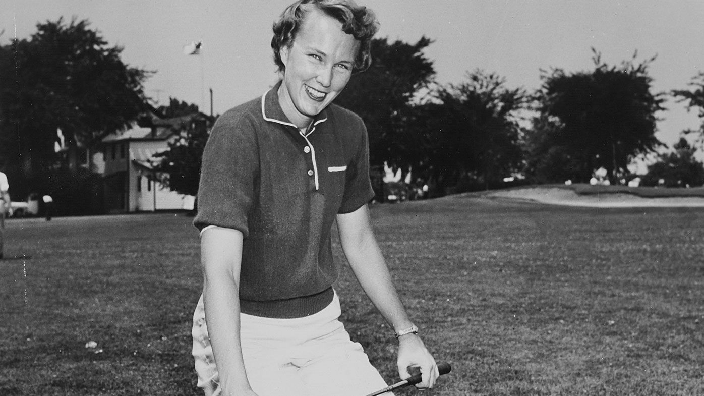 Mickey Wright show off her golf bag and clubs during her heyday