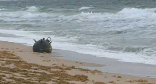 A portion of the beach had to be closed as the bomb squad and X worked to remove the device.