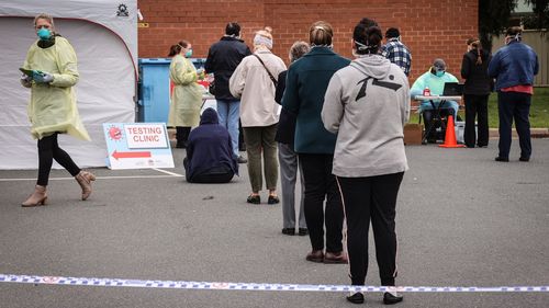 People wait in lines to be tested for COVID-19 at a 'pop-up' clinic on July 7, 2020 in the border town of Albury, Australia. 