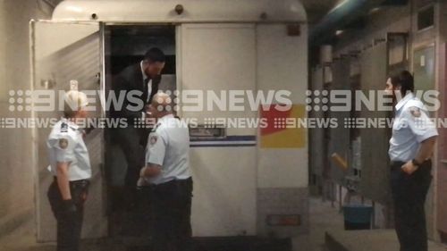 Controversial Sydney businessman Salim Mehajer has arrived at Burwood Local Court for day two of an alleged AVO breach hearing wearing a suit and handcuffs. Picture: 9NEWS.