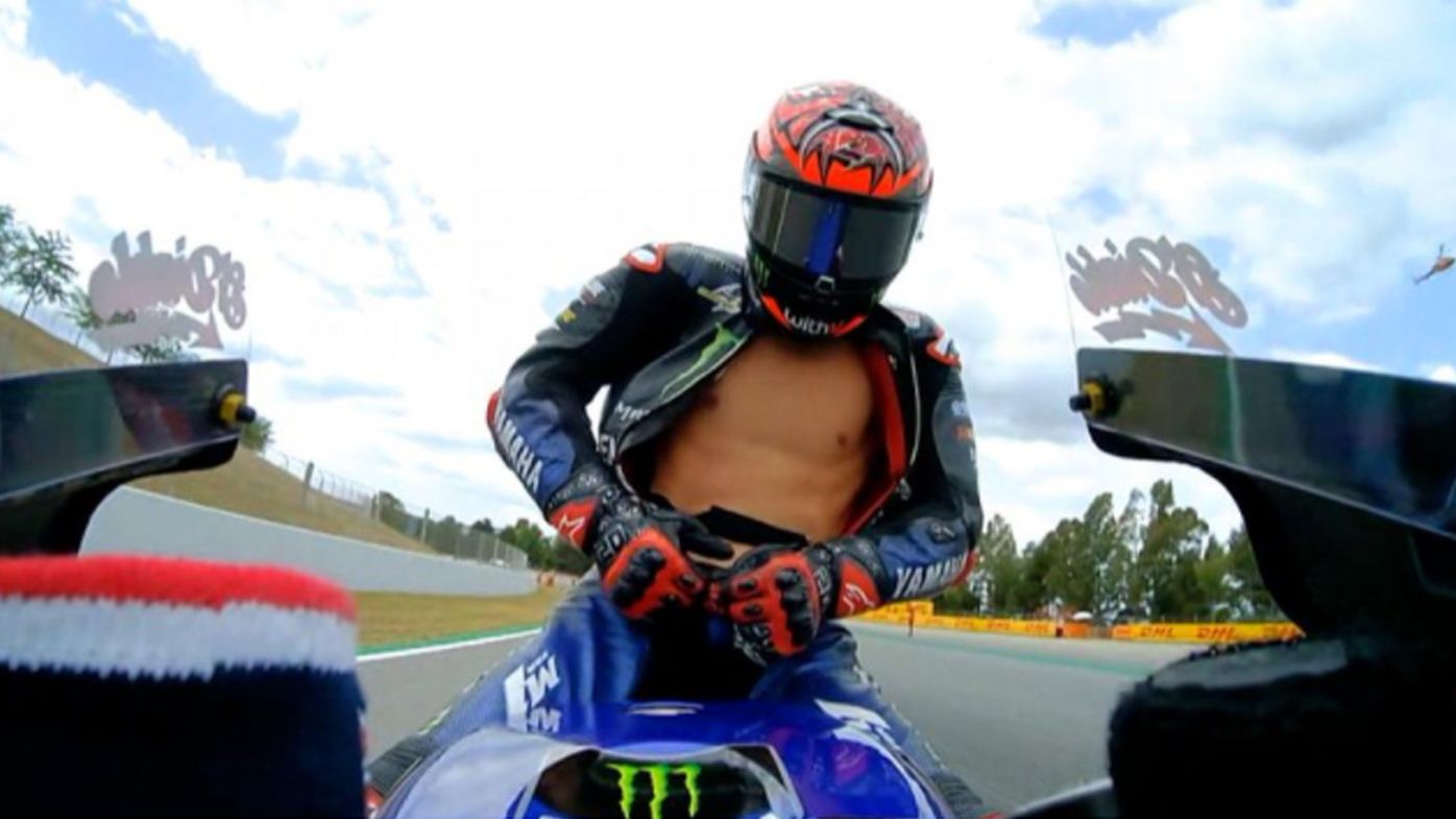  Fabio Quartararo rides with his leathers unzipped